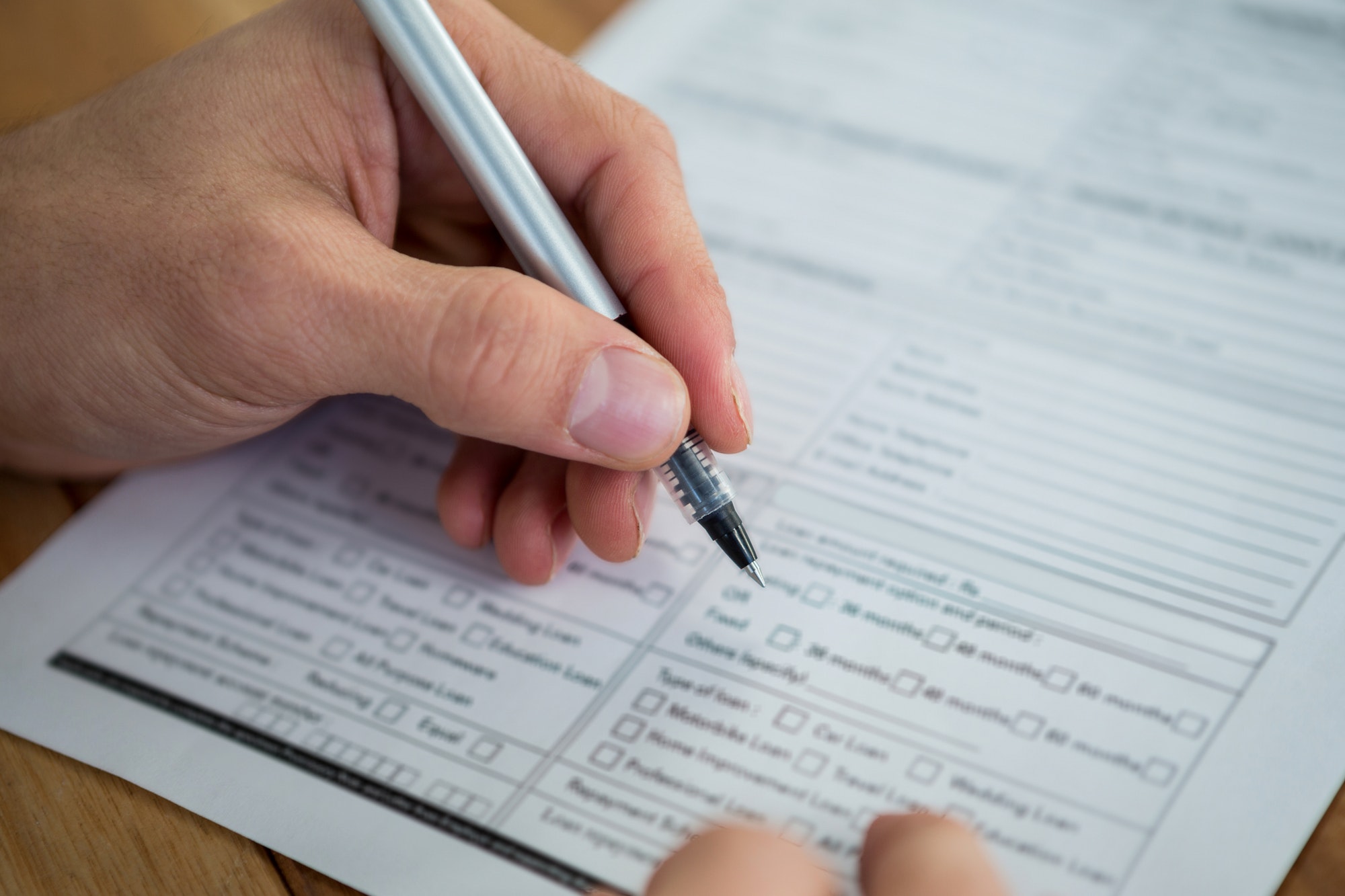 Businesswoman filling last will and testament form